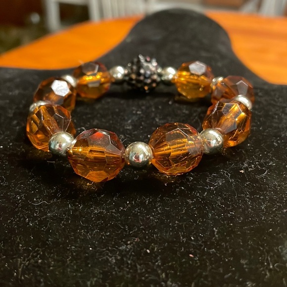 8” stackable stretch bracelet with 8 amber color & 9 silver tone beads - Picture 1 of 13